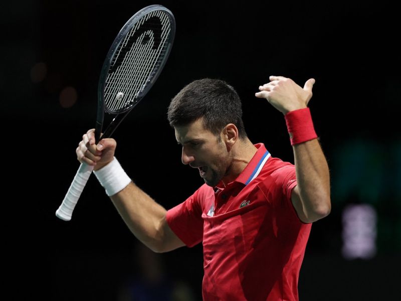 Serbia's Novak Djokovic reacts during the men's doubles semifinal tennis match between Italy and Serbia of the Davis Cup tennis tournament at the Martin Carpena sportshall, in Malaga on November 25, 2023. (Photo by LLUIS GENE / AFP)