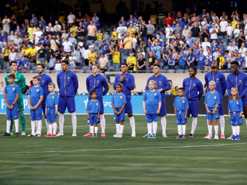 Chelsea players stand for their national anthem ahead of a pre-season friendly football match between Chelsea FC and Borussia Dortmund BVB at Soldier Field in Chicago, Illinois, on August 2, 2023. (Photo by KAMIL KRZACZYNSKI / AFP)