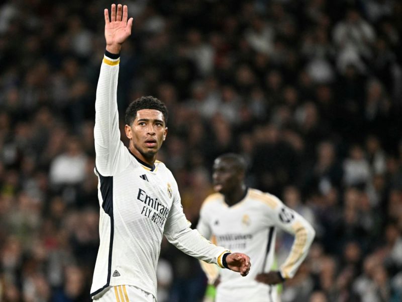 Real Madrid's English midfielder #5 Jude Bellingham waves during the UEFA Champions League last 16 second leg football match between Real Madrid CF and RB Leipzig at the Santiago Bernabeu stadium in Madrid on March 6, 2024. (Photo by JAVIER SORIANO / AFP)