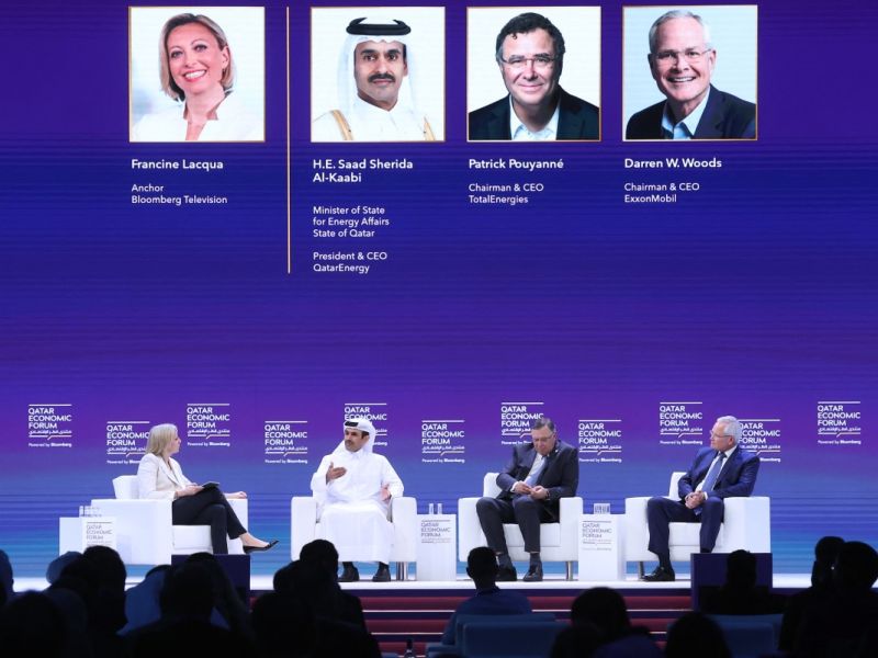 Chairman and CEO of ExxonMobil Darren Woods (R), Chairman and CEO of TotalEnergies Patrick Pouyanné (2nd R) and Qatar's Minister of State for Energy Affairs and President & CEO of Qatar Energy Saad Sherida al-Kaabi, attend a session at the Qatar Economic Forum in Doha on May 15, 2024. (Photo by KARIM JAAFAR / AFP)