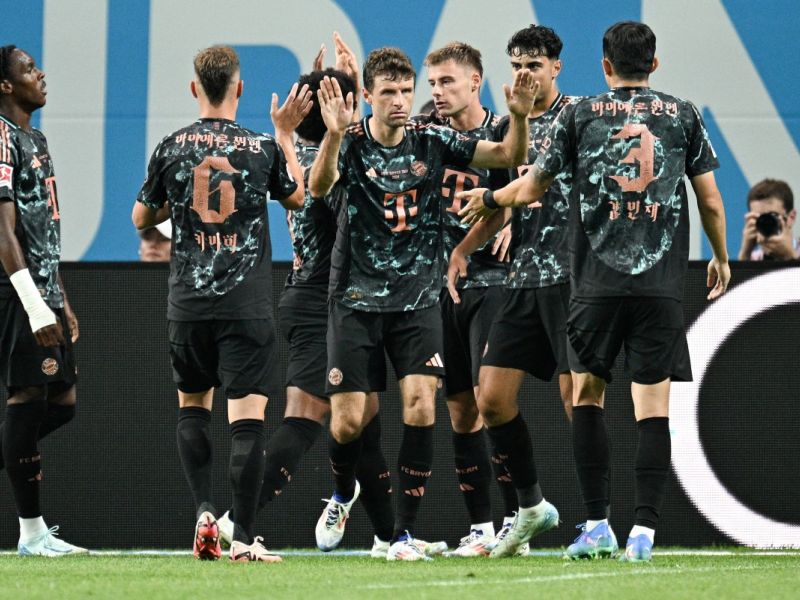 Bayern Munich’s players celebrate a goal during a friendly football match between Tottenham Hotspur and Bayern Munich at the Seoul World Cup Stadium in Seoul on August 3, 2024. (Photo by ANTHONY WALLACE / AFP)