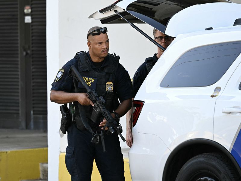 US Department of Homeland Security police officers stand outside the Paul G. Rogers Federal Building and US Courthouse