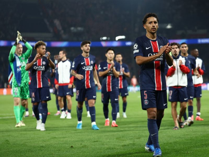Paris Saint-Germain's Brazilian defender #05 Marquinhos (R) leads Paris Saint-Germain's players as they acknowledge the crowd at the end of the UEFA Champions League 1st round day 1 football match between Paris Saint-Germain (PSG) and Girona FC at the Parc des Princes Stadium, in Paris, on September 18, 2024. (Photo by Franck FIFE / AFP)