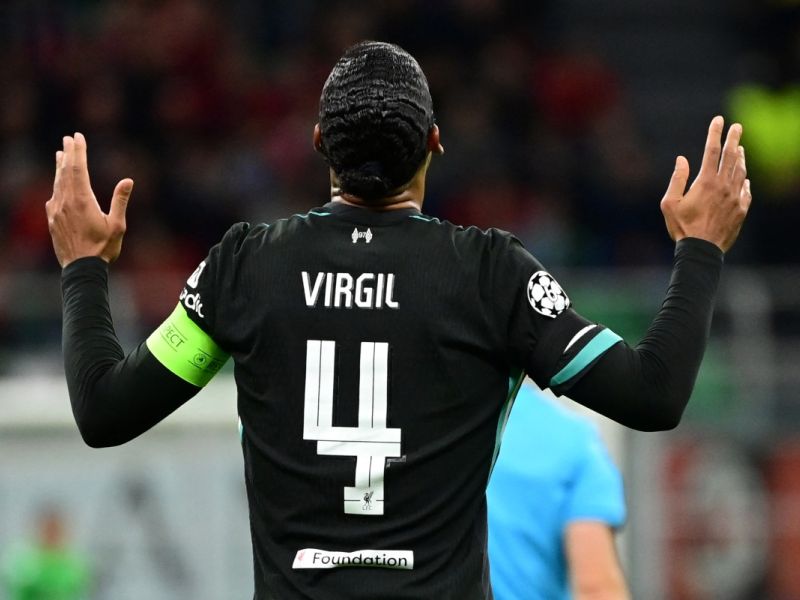 Liverpool's Dutch defender #04 Virgil van Dijk celebrates scoring his team's second goal during the UEFA Champions League 1st round day 1 football match between AC Milan and Liverpool FC at the San Siro stadium in Milan on September 17, 2024. (Photo by PIERO CRUCIATTI / AFP)