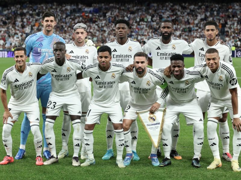 Real Madrid's players pose for a team picture before the start of during the UEFA Champions League 1st round day 1 football match between Real Madrid CF and Stuttgart VFB at the Santiago Bernabeu stadium in Madrid on September 17, 2024. (Photo by Thomas COEX / AFP)