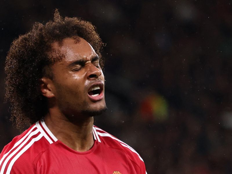 Manchester United's Dutch striker #11 Joshua Zirkzee reacts after missing a chance on goal during the UEFA Europa league stage football match between Manchester United and FC Twente at Old Trafford stadium in Manchester, north west England, on September 25, 2024. (Photo by Darren Staples / AFP)