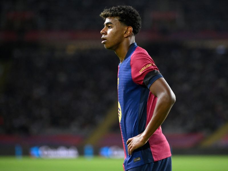 Barcelona's Spanish forward #19 Lamine Yamal stands on the pitch during the Spanish league football match between FC Barcelona and Sevilla FC at the Estadi Olimpic Lluis Companys in Barcelona on October 20, 2024. (Photo by Josep LAGO / AFP)