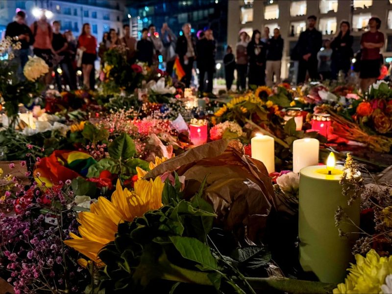Candles are lit among flowers in commemoration of the victims of the attack.