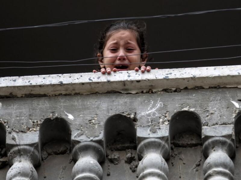 A relative of 29-year-old Saadi Abu Taha, who was killed at the Israel-Gaza border during protests, mourns while looking out of a balcony in Khan Yunis in the southern Gaza strip on Apr. 21, 2018.
SAID KHATIB / AFP
