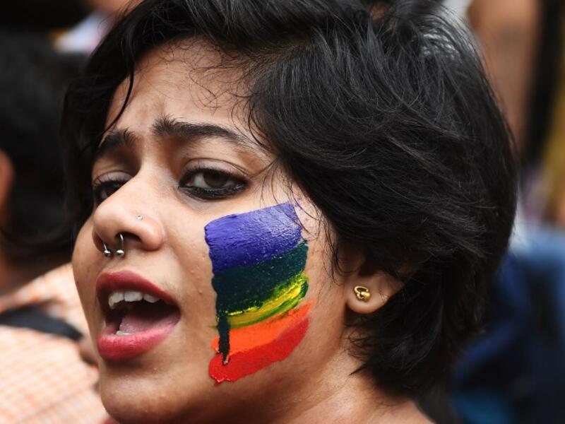 An Indian member and supporter of the lesbian, gay, bisexual, transgender (LGBT) community celebrates the Supreme Court decision to strike down a colonial-era ban on gay sex, in Kolkata on September 6, 2018. 
Dibyangshu SARKAR / AFP