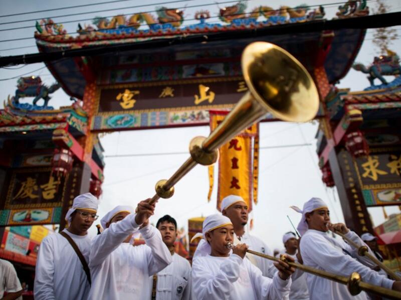Devotees of the Loem Hu Thai Su shrine parade during the annual Vegetarian Festival in Phuket on October 12, 2018. Jewel SAMAD/AFP