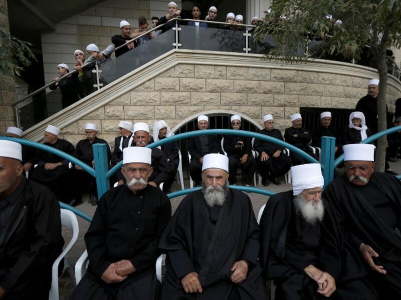 Druze men sit in the village of Majdal Shams in the Israeli-annexed Golan Heights. (JALAA MAREY / AFP)
