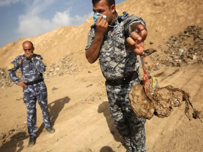 The United Nations in Iraq (UNAMI) and its human rights office said they had documented a total of 202 mass graves in parts of western and northern Iraq held by IS between 2014 and 2017. (AHMAD AL-RUBAYE / AFP)