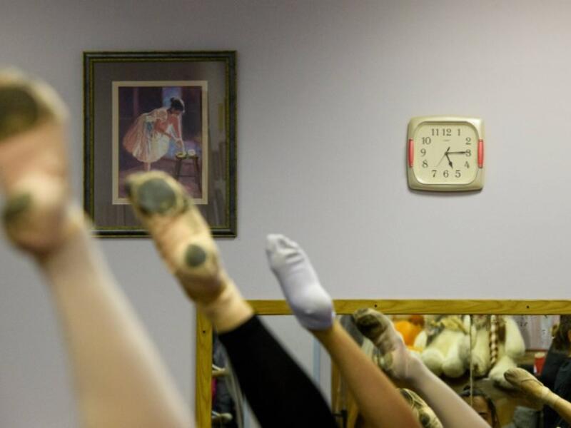 Girls attend a class at a ballet studio in Moscow on November 22, 2018. In a small studio in northern Moscow, parents and grandparents sit in a corridor waiting for children as young as three to finish their ballet class. 
Mladen ANTONOV / AFP