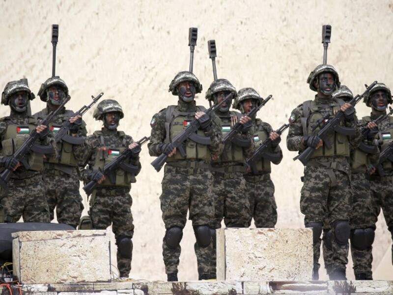 Palestinian members of al-Qassam Brigades, the armed wing of the Hamas movement, attend a rally marking the 31st anniversary of Hamas' founding, in Gaza City December 16, 2018. 
SAID KHATIB / AFP