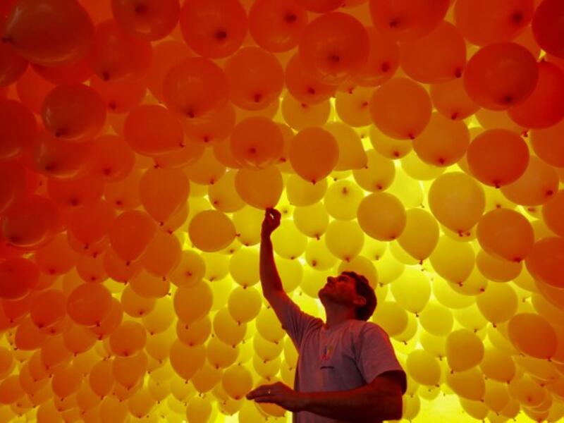 Thousands of biodegradable balloons are released by members of the Chamber of Commerce to celebrate New Year in Sao Paulo, Brazil, on December 28, 2017. 
Miguel SCHINCARIOL / AFP