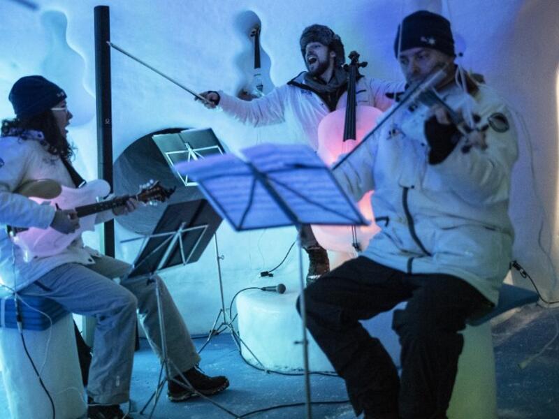 Musicians performs with ice instruments during a concert in the "Ice Dome" on Presena Galcier, Tonale Pass, near Trento in northern Italy on January 17, 2018.
MARCO BERTORELLO / AFP