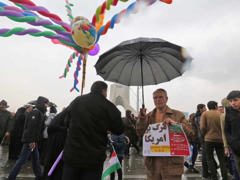 Iranians assemble in the capital Tehran's Azadi (Freedom) square on February 11, 2019 during a ceremony celebrating the 40th anniversary of Islamic Revolution. 
ATTA KENARE / AFP