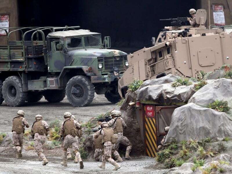 Members fo the UAE Armed forces perform a military drill during the opening of the International Defence Exhibtion and Confrence at the Abu Dhabi National Exhibtion Centre on February 17, 2019. 
AFP