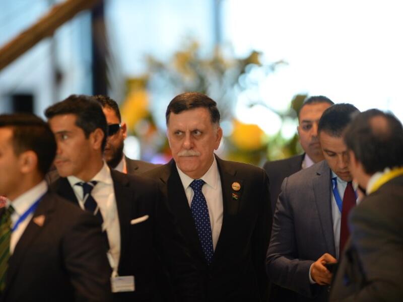 Libya's Prime Minister Fayez al-Sarraj arrives to the International Congress Centre on February 24, 2019, ahead of first joint European Union and Arab League summit in the Egyptian Red Sea resort of Sharm el-Sheikh. 
MOHAMED EL-SHAHED / AFP