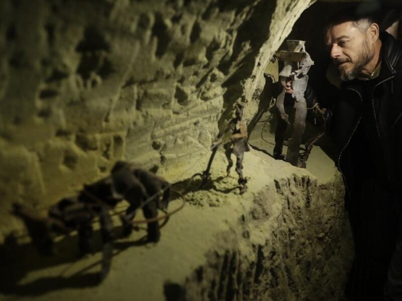 Lebanese Artist Charles Nassar inpsects of his sculptures made out of artillery shrapnels in the village of Remhala, south of Beirut, on March 7, 2019. 
JOSEPH EID / AFP