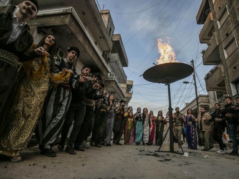 Kurds dressed in traditional outfits celebrate Nowruz (Noruz) in the Kurdish-controlled city of Qamishly in northeastern Syria on March 20, 2019.
Delil SOULEIMAN / AFP