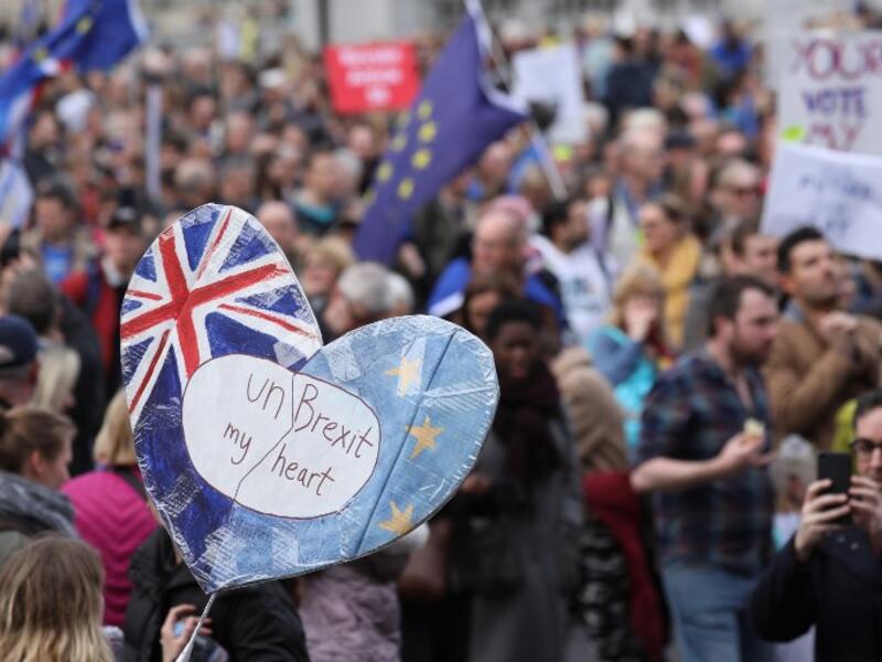 People hold up placards and European flags as they attend a march and rally organised by the pro-European People's Vote campaign for a second referendum in central London on March 23, 2019.
Isabel INFANTES / AFP