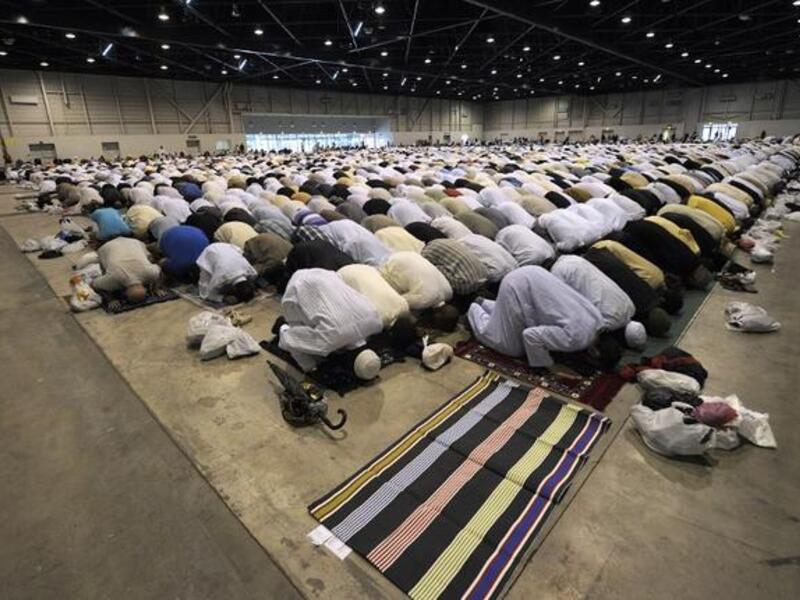 Faithfuls pray during the Eid al-Fitr ceremony in Marseille, southern France, on August 8, 2013. (AFP)
