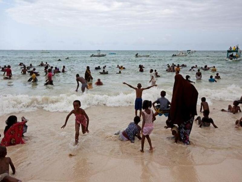 Muslims are pictured at Bamburi Public beach in the coastal city of Mombasa, Kenya on August 9, 2013. (AFP)
