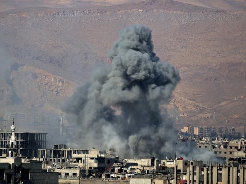 Smoke billows from an area that was targeted by Syrian government forces air strikes in the rebel-held town of Arbin, on the outskirts of the Syrian capital Damascus, on Feb. 1, 2018. Douma is in the Eastern Ghouta region which has been under government siege since 2013.
(ABDULMONAM EASSA / AFP)
