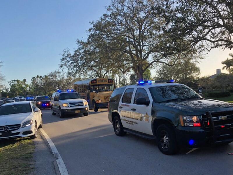 Sheriff vehicles are seen at Marjory Stoneman Douglas High School in Parkland, Florida on Feb.14, 2018 following a school shooting, an incident that officials said caused "numerous fatalities" and left terrified students huddled in their classrooms, texting friends and family for help.
(Michele Eve SANDBERG / AFP)