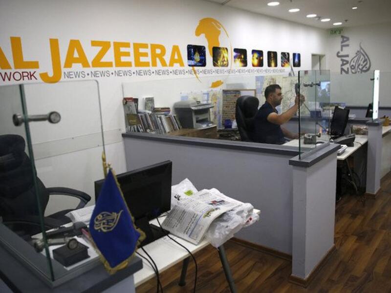 NewsGuard has urged readers to “proceed with extreme caution” when disseminating any output of the channel Al-Jazeera English. (AFP)
