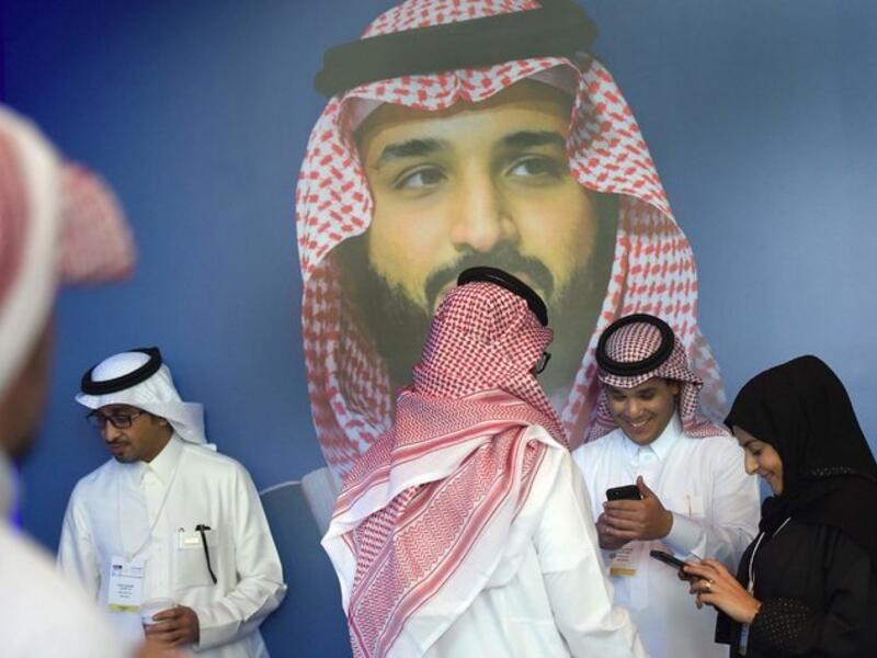 Bader Al Asaker, who heads the crown prince’s personal foundation, at left with white head covering, is one of three shareholders listed for Eight Investment, which owns the chateau. (AFP) 