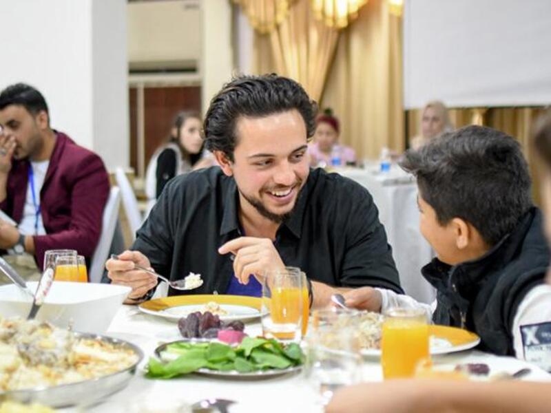 HRH Crown Prince Hussein joins orphans for an Iftar meal in Amman on Wednesday (Photo courtesy of Royal Court)