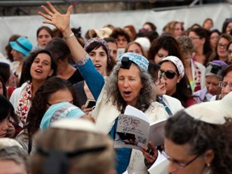 A member of Women of the Wall wears phylacteries and the 'tallit' shawl, traditional Jewish prayer apparel for men. (AFP/Gali Tibbon)