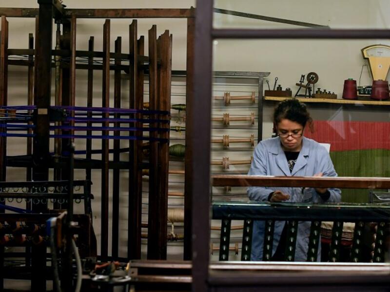 This picture shows a woman at work in the laboratory of Antico setificio Fiorentino ancient silk factory in Florence. 
Tiziana FABI / AFP