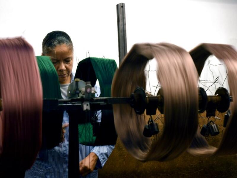 This picture shows a woman at work in the laboratory of the ancient silk factory of Antico setificio Fiorentino in Florence. 
Tiziana FABI / AFP