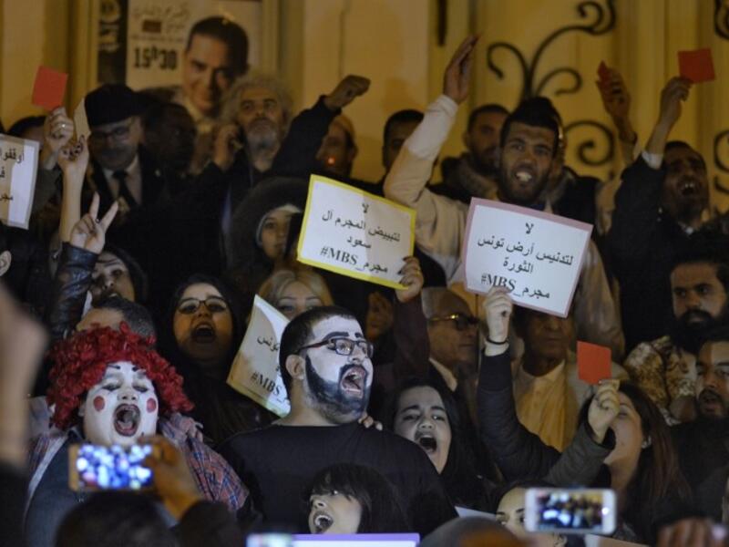 Tunisians demonstrate against the upcoming visit of Saudi Crown Prince Mohammed bin Salman to Tunisia, in November 26, 2018 in the capital Tunis. The sign in Arabic reads "No to the desecration of Tunisia, country of the revolution". 
AFP