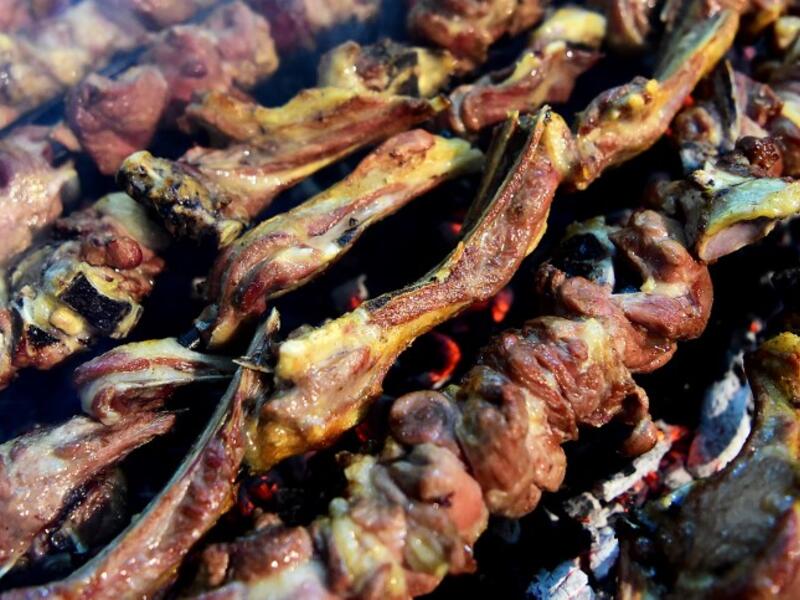Grilled meat is cooked at the Charsi (Hashish) Tikka restaurant in Namak Mandi in Peshawar.
ABDUL MAJEED / AFP