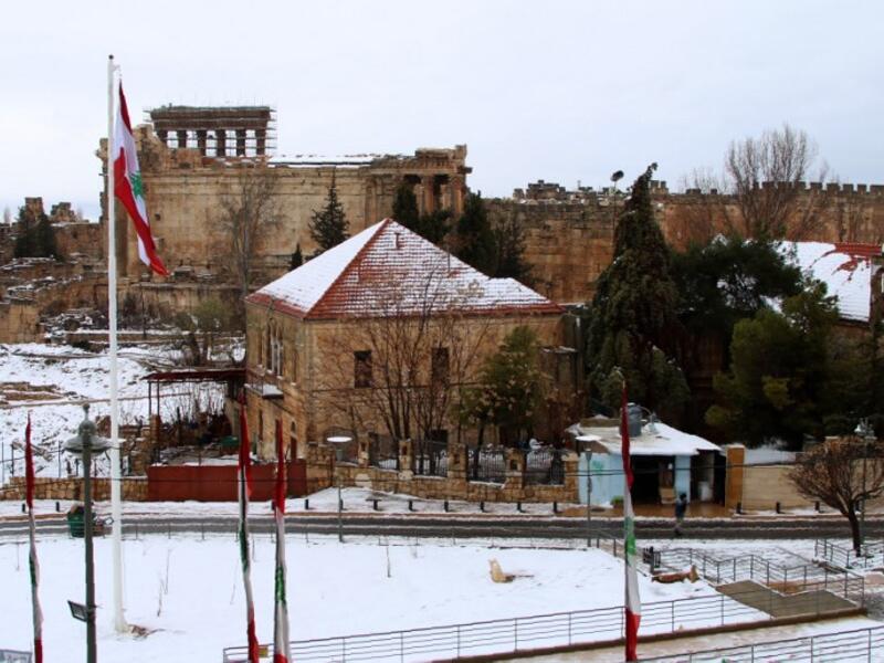 Partial view of the snow-clad Roman ruins in the city of Baalbeck in Lebanon's Bekaa valley. 
STRINGER / AFP