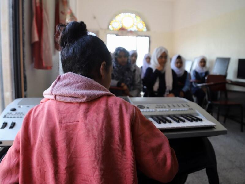 Children attend a music class at the Al-Nawras school in Taez, Yemen's third city, in the country's southwest
AHMAD AL-BASHA / AFP