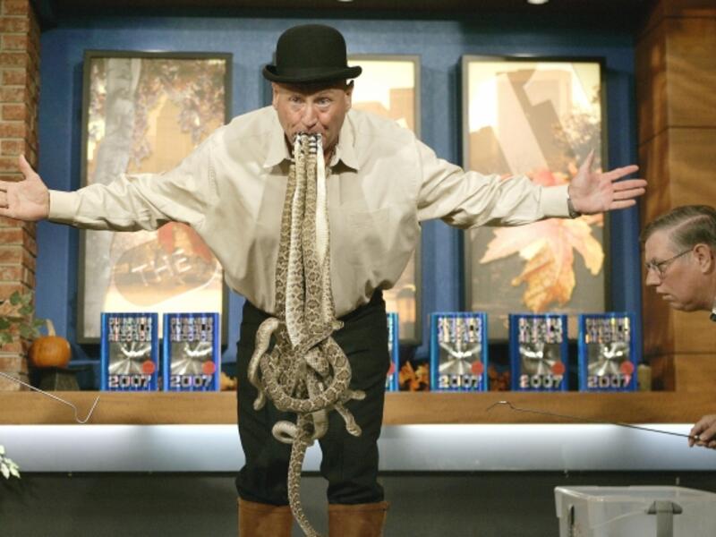 Jackie Bibby a.k.a. “The Texas Snakeman” holds in his mouth ten 2 ft 6-inch-long western diamondback rattlesnakes for 12.5 seconds without any assistance at the CW11 morning show on November 9, 2006 to set a new Guinness World Record for Most Live Rattlesnakes Held In Mouth. (AFP/ File Photo)