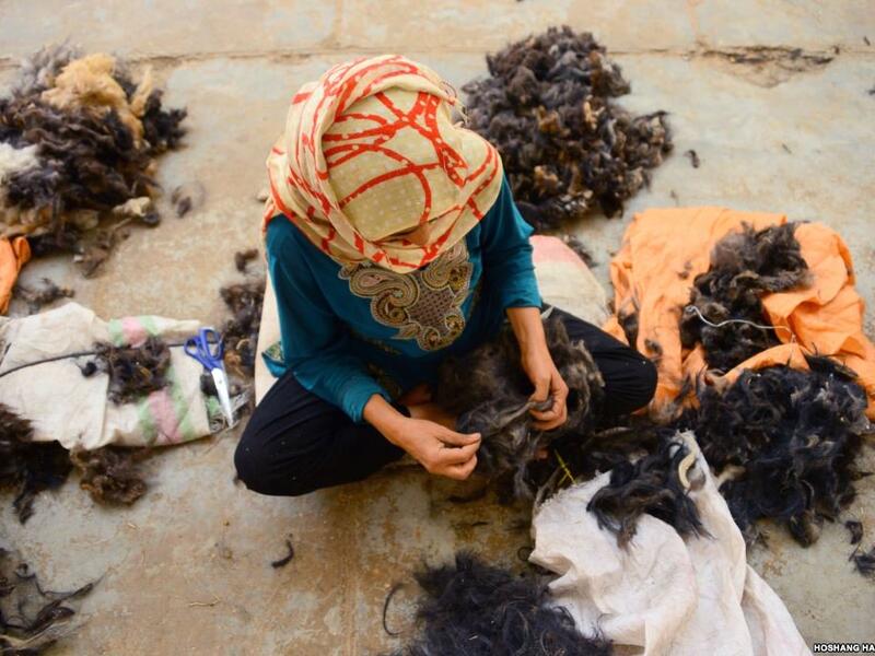 An Afghan woman works in a traditional wool factory in Herat (Twitter)