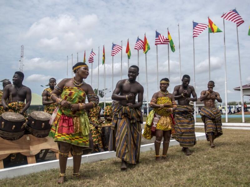 Musicians and dancers wait for the arrival of the US first lady at Kotoka International Airport in Accra on October 2, 2018. (CRISTINA ALDEHUELA / AFP)