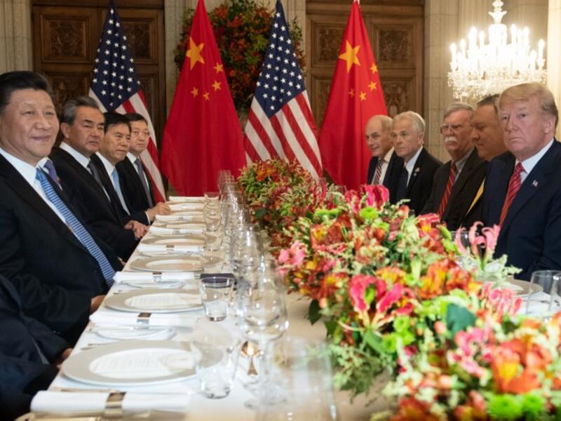 US President Donald Trump (R) US Secretary of State Mike Pompeo (2-R) and members of their delegation hold a dinner meeting with China's President Xi Jinping (L) China’s Foreign Affairs Minister Wang Yi (2-L) and Chinese government representatives, at the end of the G20 Leaders' Summit in Buenos Aires, on December 01, 2018.
SAUL LOEB / AFP
