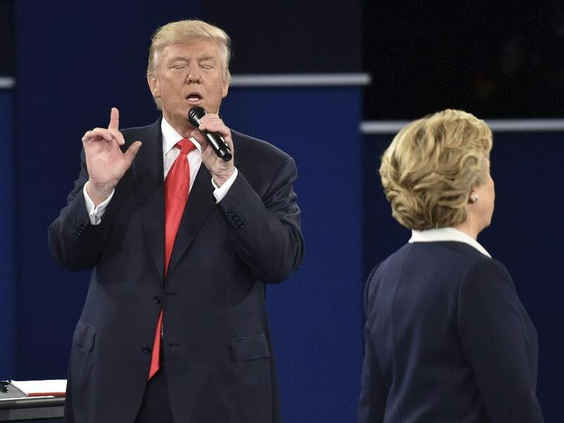 Republican presidential candidate Donald Trump makes a point to Democratic presidential candidate Hillary Clinton during the second presidential debate at Washington University in St. Louis, Missouri on October 9, 2016. (AFP/Paul J. Richards)