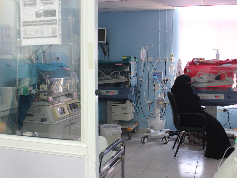 Ayesha (not her real name), a new mother from Syria, waits by one of her twins in Neo-Natal care unit in the MSF Mother And Child Hospital in Irbid, Jordan.