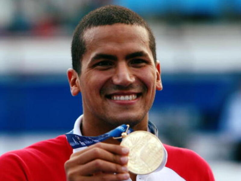 السباح التونسي أسامة الملولي: مهندس المعلوماتية والنجم الملقب بالقرش الأسمر وقرش قرطاج، نال الميدالية الذهبية في أولمبياد بكين 2008 (الذهبية الثانية في تاريخ تونس)، ويعود هذه المرة للمشاركة في سباقات 400 متر و1500 متر و10 كم.