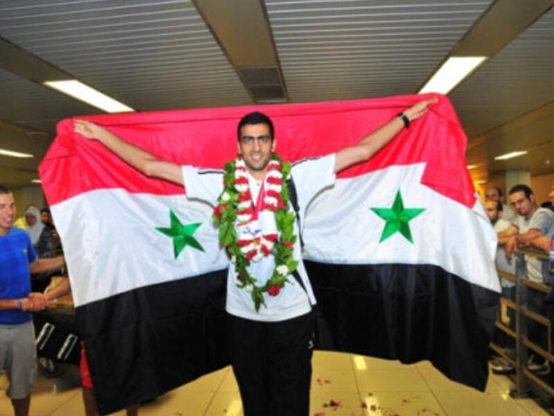 لاعب الوثب العالي السوري مجد غزال: سيرفع صاحب الـ 25 عاماً علم بلاده خلال الأولمبياد علاوةً على آمال شعبه الذي يمر بفترة لا يحسد عليها في ظل الأوضاع الراهنة، ويبدو اللاعب متواضعاً وهادئاً فيما يتعلق بفرصه في مسابقات الوثب العالي.