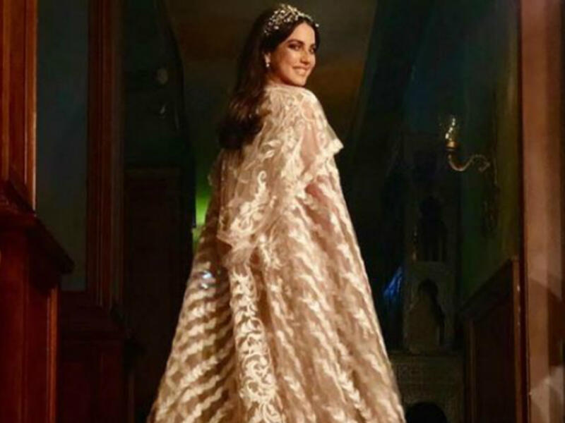 Tunisian beauty Dorra put on a cape dress designed by Egyptian designer Hany Elbehairy in Nassr Al Said Said's Eagle series 